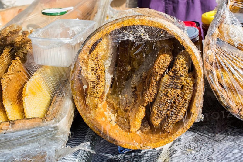 Sweet fresh honey in the sealed comb frame