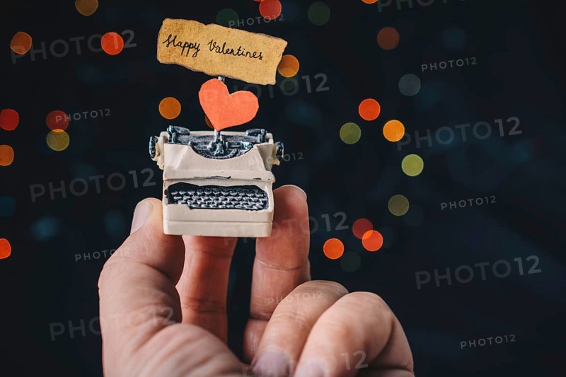 Valentine's day wording on torn typewriter as Love concept