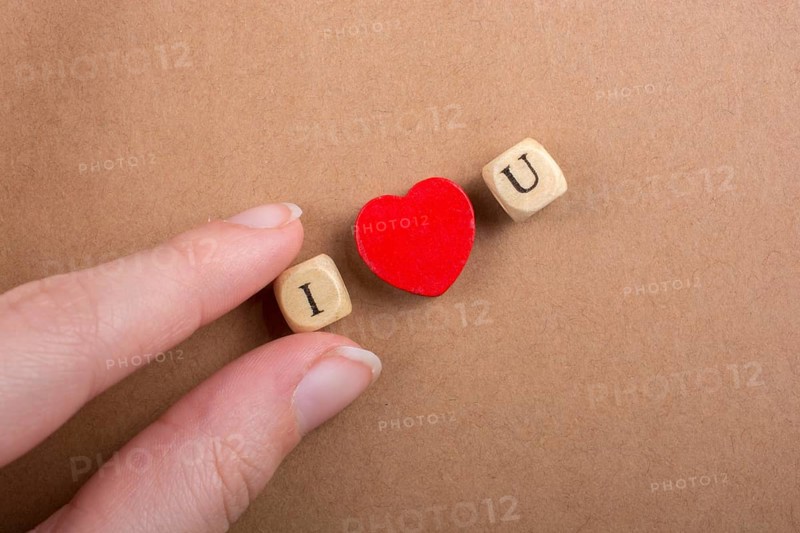 Phrase I Love You Made from Letter Cubes in in hand
