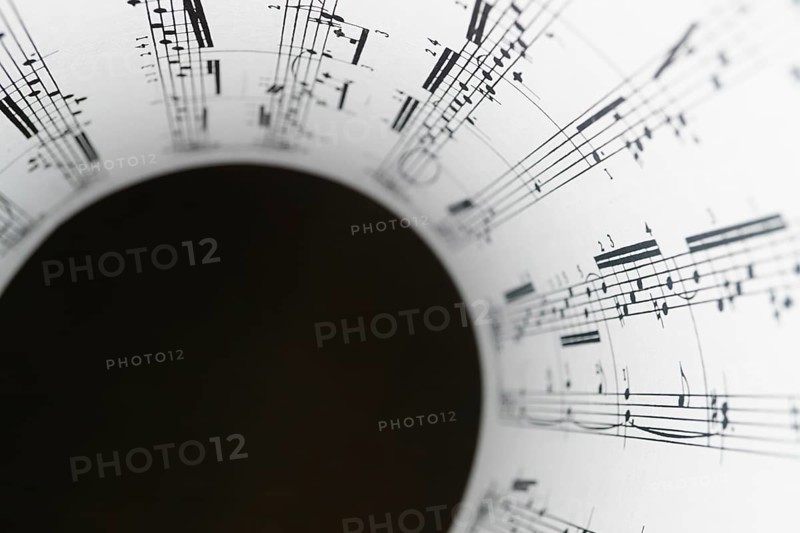 Circular rolled score with blurred black background