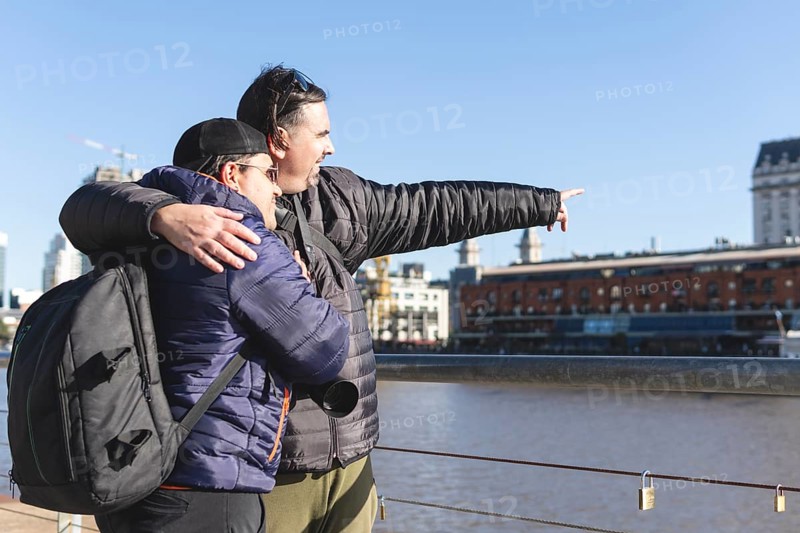 Tourist gay couple exploring Puerto Madero