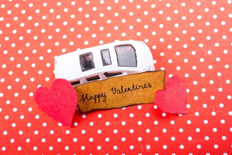 Love icon and Valentine's day wording on torn paper