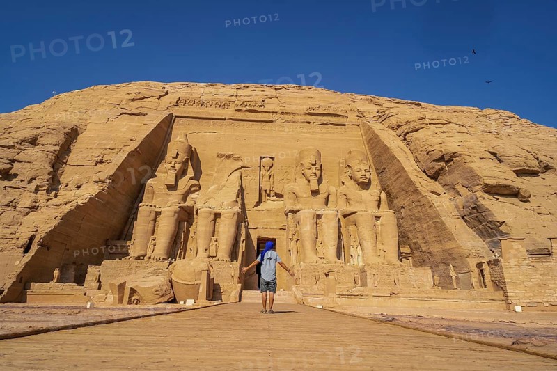 A European tourist visiting the Abu Simbel Temple in southern Egypt in Nubia next to Lake Nasser. Temple of Pharaoh Ramses II