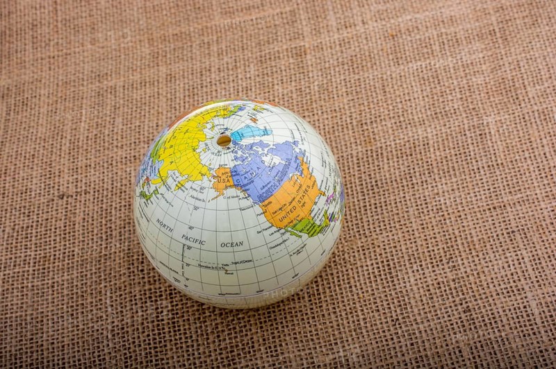 Globe placed on a brown fabric background