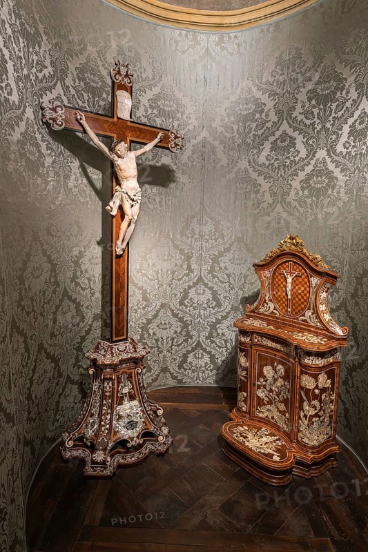 Devotional room with elaborate wooden and ivory crucifix and devotional altar with inlay work