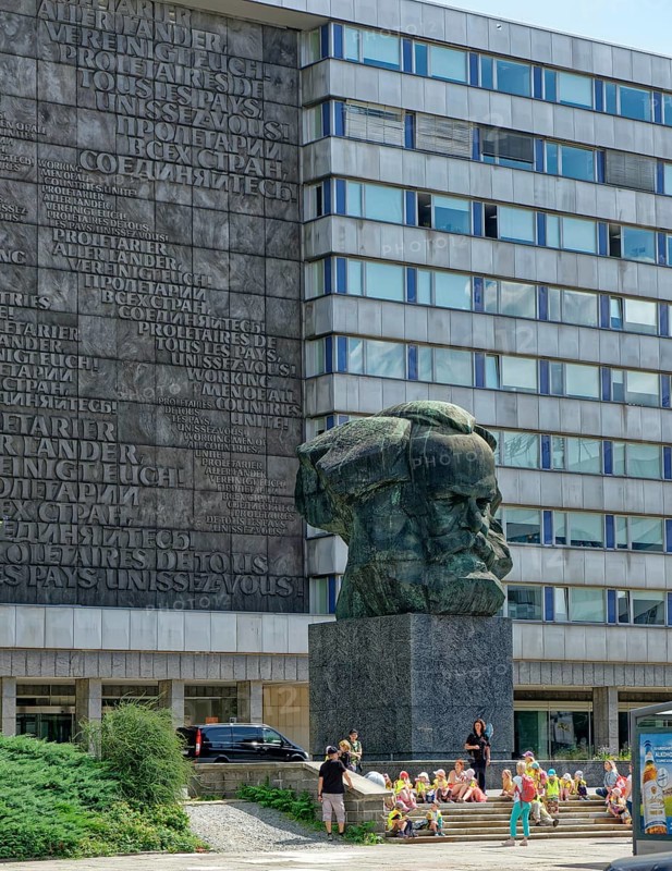 Group of children at the Karl Marx Monument after a design by the Soviet artist Lew Kerbel