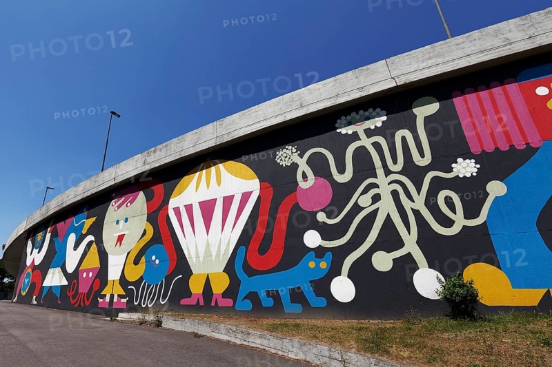 Colourful mural with fantasy figures by graffiti artist Mariana Malhao