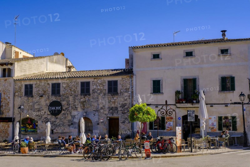 Sidewalk cafes in front of the church