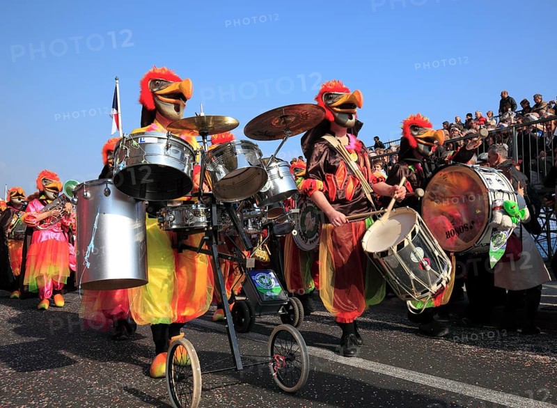 Musicians in fantasy costumes at the street parade in Menton