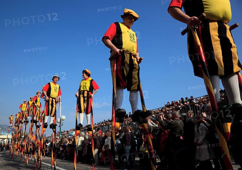 Stilt walkers in the street parade in Menton