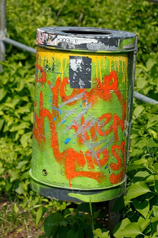 Colourfully painted metal wastepaper basket