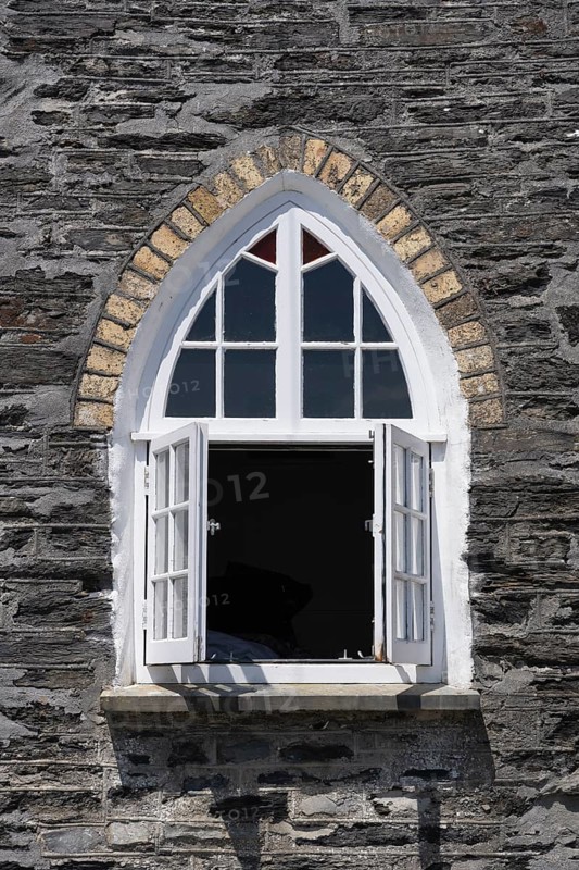 Gothic style windows on the former schoolhouse in Port Isaac