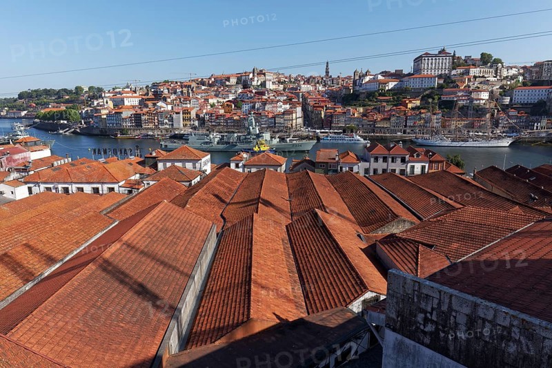 View over the roofs of port wine cellars in Vila Nova de Gaia to the historic old town of Porto