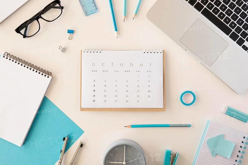Flat lay desk calendar blue office accessories