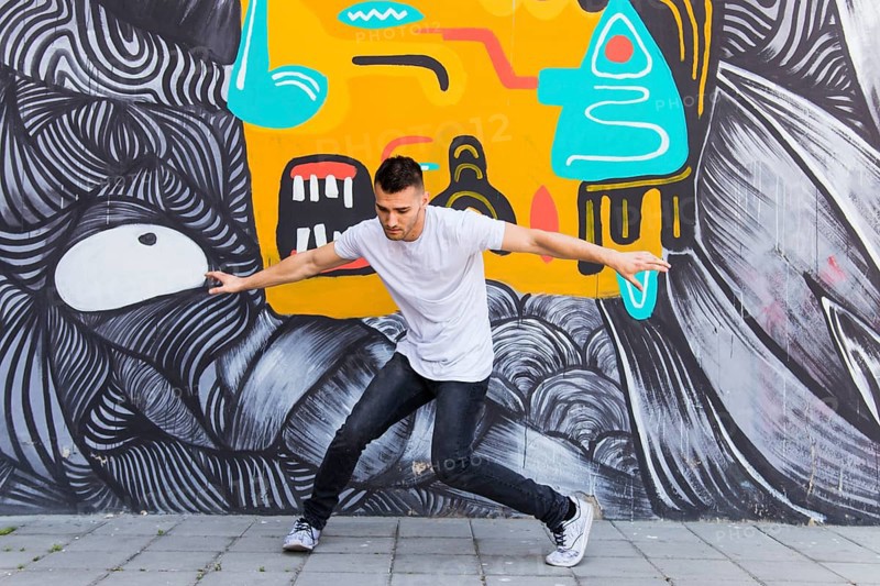 Young man dancing street