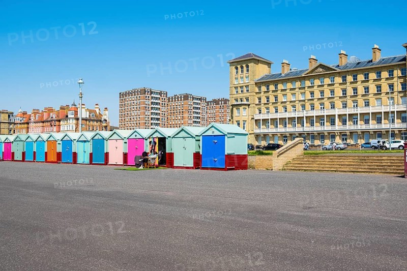 Row of beautiful colourful seaside bathing cottages in Brighton and Hove
