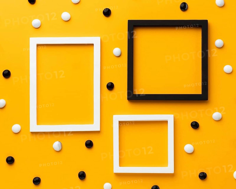 Pebbles yellow background top view