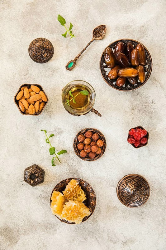 Tea glass with dates fruit nuts table