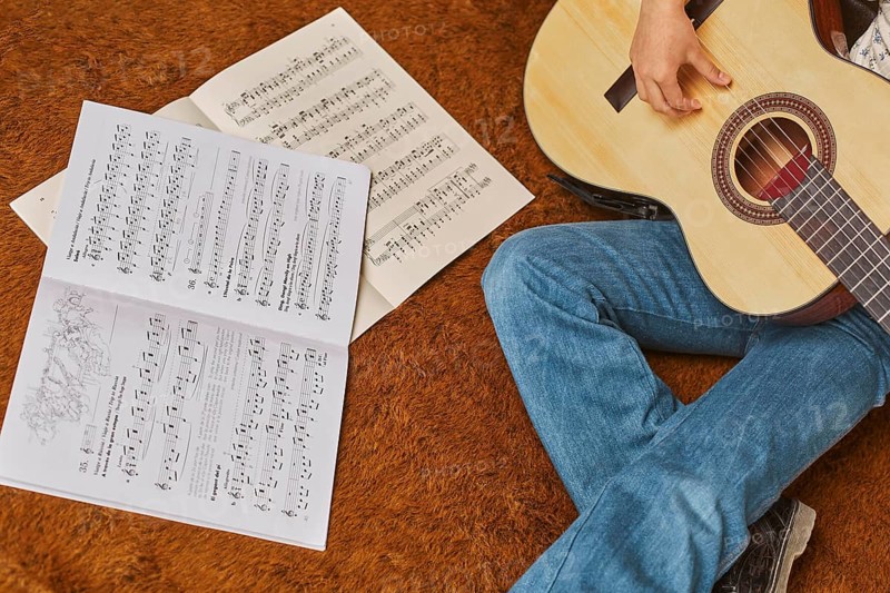 Girl playing guitar home