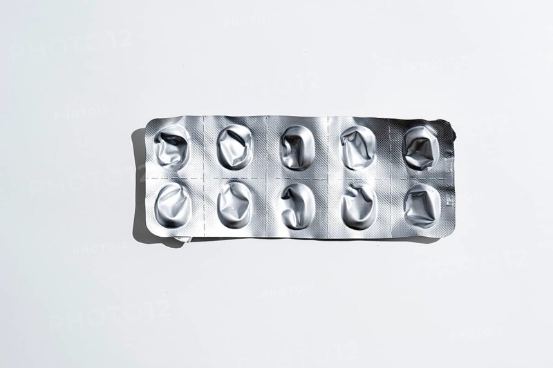 Empty tablet blister pack against white background