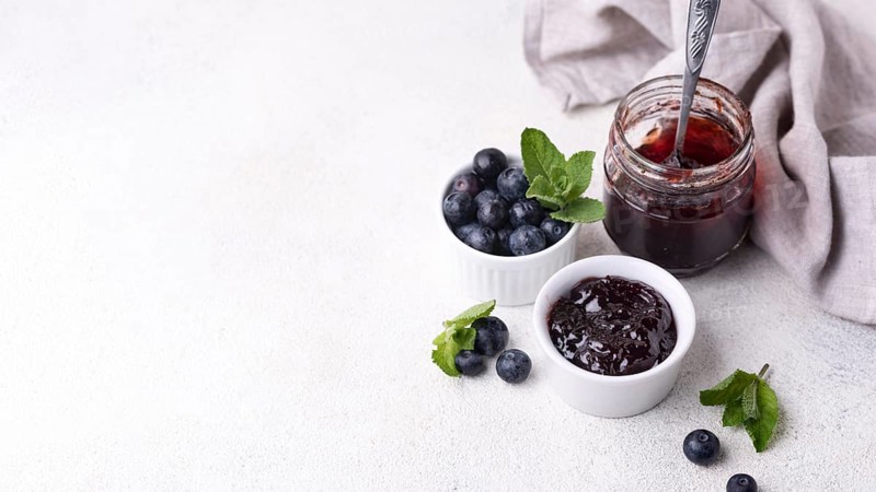 Delicious blueberry jam with copy space