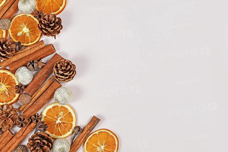 Seasonal winter flat lay with dried orange slices