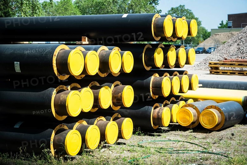 A stack of new pipes for district heating at a construction site in Duesseldorf
