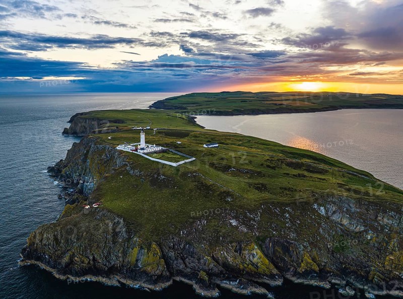 Sunset over Mull of Galloway Lighthouse from a drone