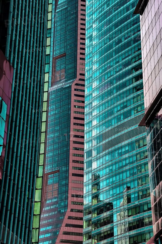 Details of close standing downtown buildings. Vertical lines