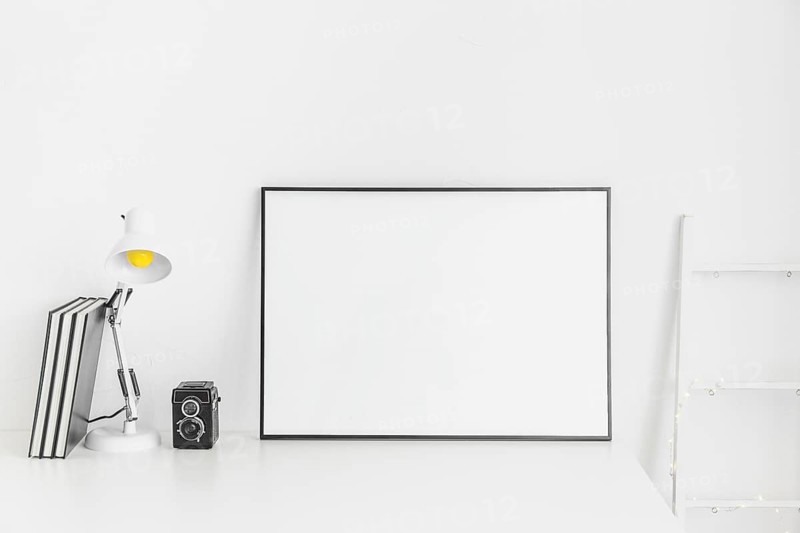 Stylish minimalistic workplace white color with whiteboard