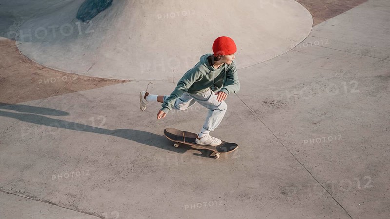 Teenager having fun skatepark with skateboard