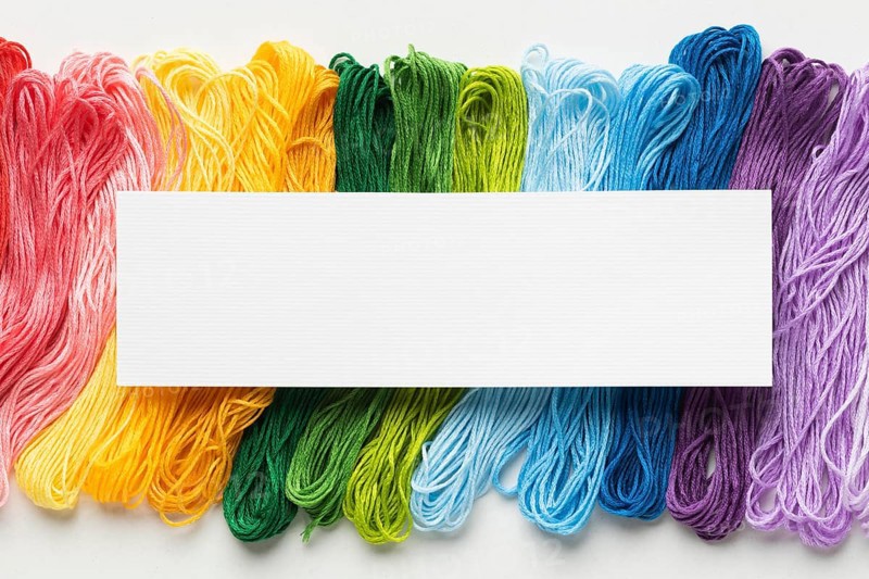 Colorful thread arrangement flat lay