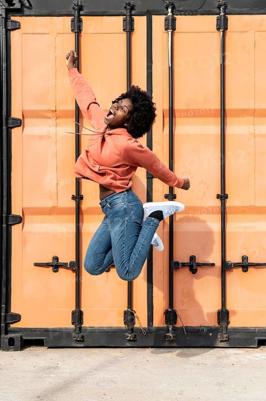 Portrait young female jumping 1