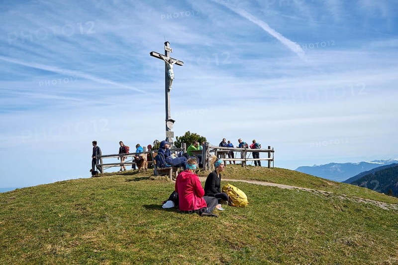 Hikers resting on the summit of Schwarzenberg