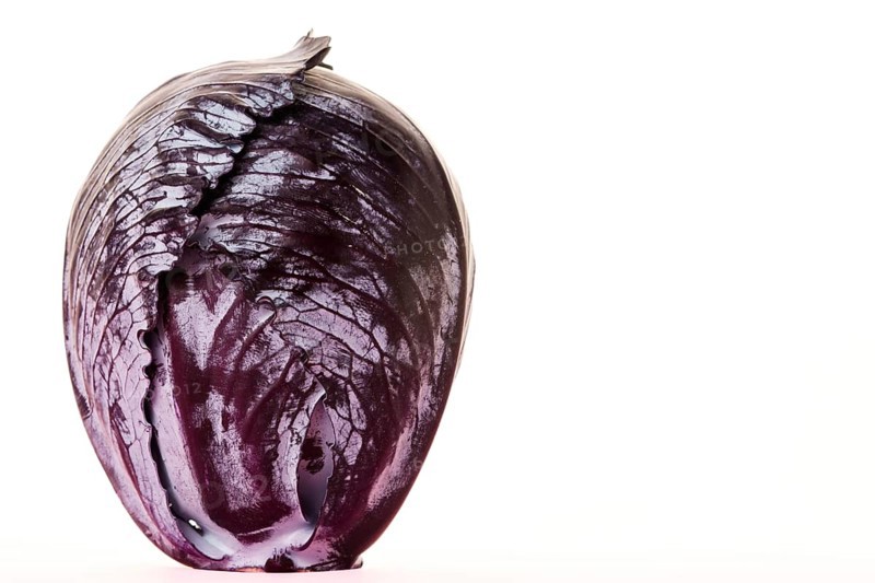 Whole red cabbage isolated on white background