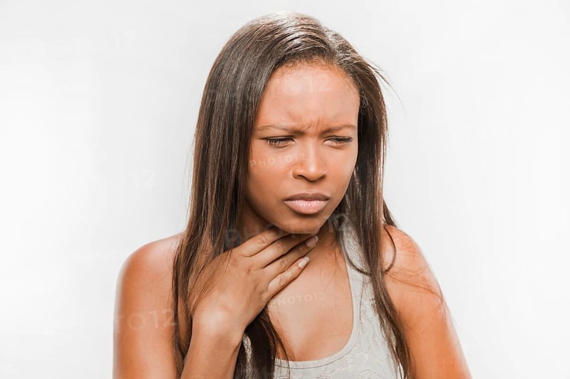 Portrait sick teenage girl with sore throat