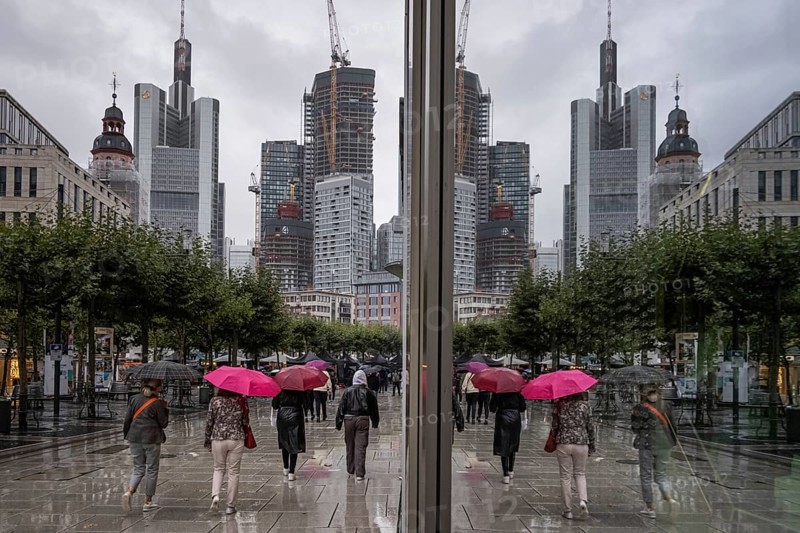 Passers-by walk along the Zeil in Frankfurt am Main during rainy weather. The summer of 2023 has so far proven to be very rainy compared to previous years.