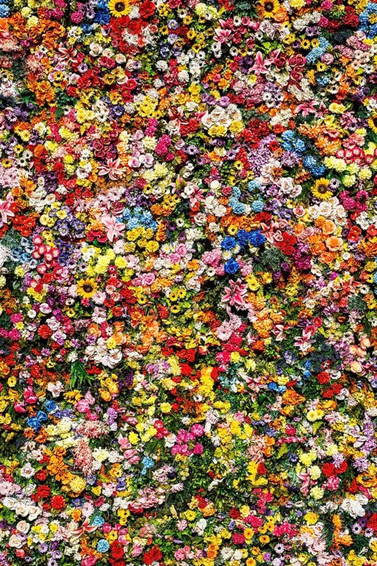 Artificial flowers on a house wall in Lisbon