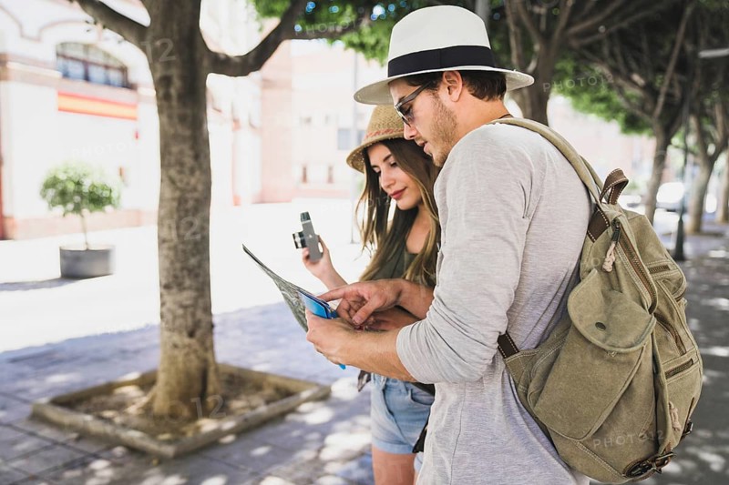 Couple tourists looking map