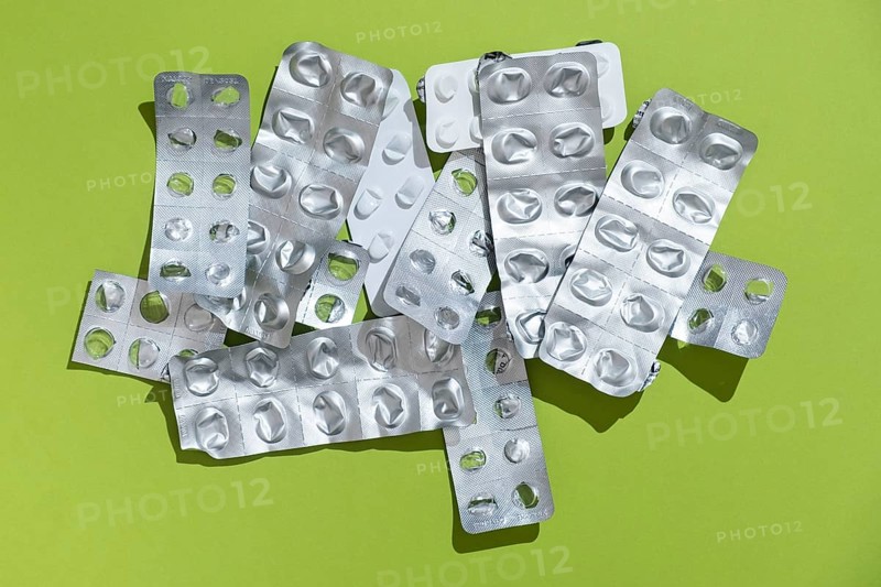 Empty tablet blister pack against a monochrome background