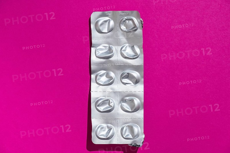 Empty tablet blister pack against a monochrome background