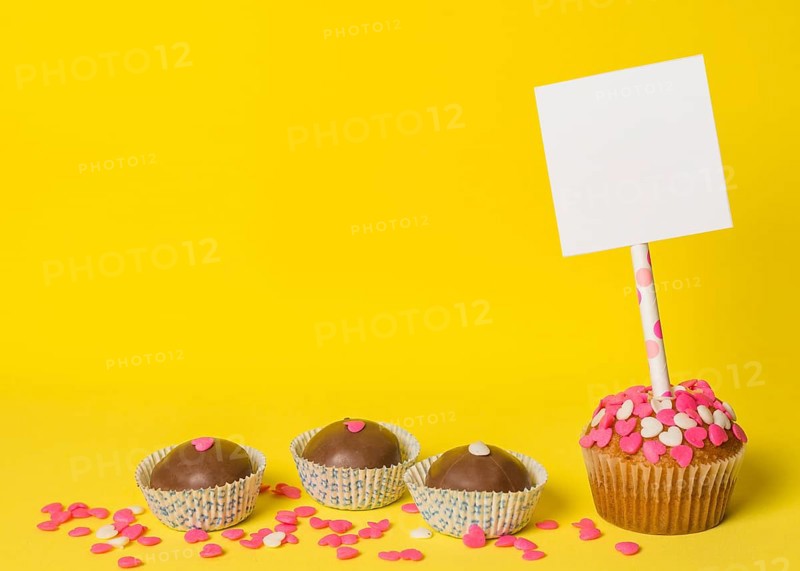 Delicious sweet candies cake with paper stick
