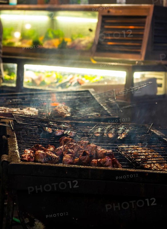 Fish and meat on a grill of a restaurant in the old town of Lisbon