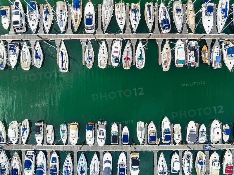 Top Down view over Boats and Yachts in Brixham Marina from a drone