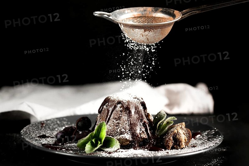 Front view chocolate cake with powdered sugar