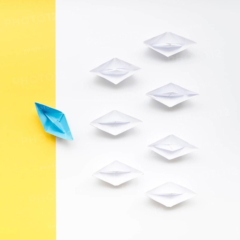 Creative arrangement individuality concept paper boats