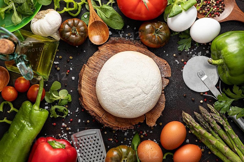 Flat lay frame vegetables dough pizza