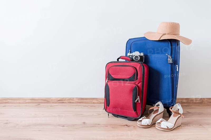 Peep toe shoes hat near suitcases camera