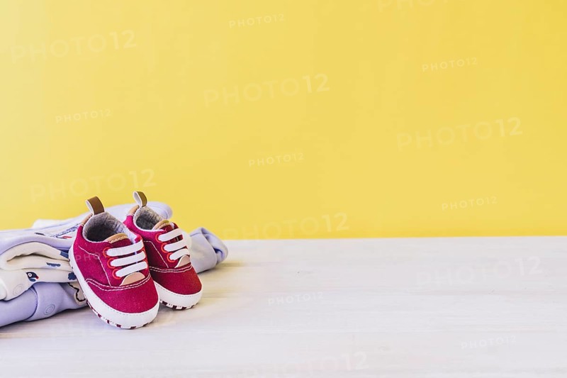 Newborn concept with shoes clothes