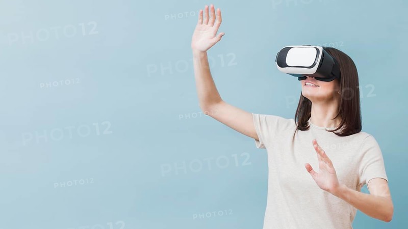 Front view woman experiencing virtual reality